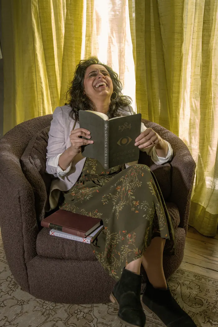 A member in conversation with an open book